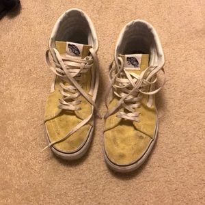 Slightly worn yellow high top vans